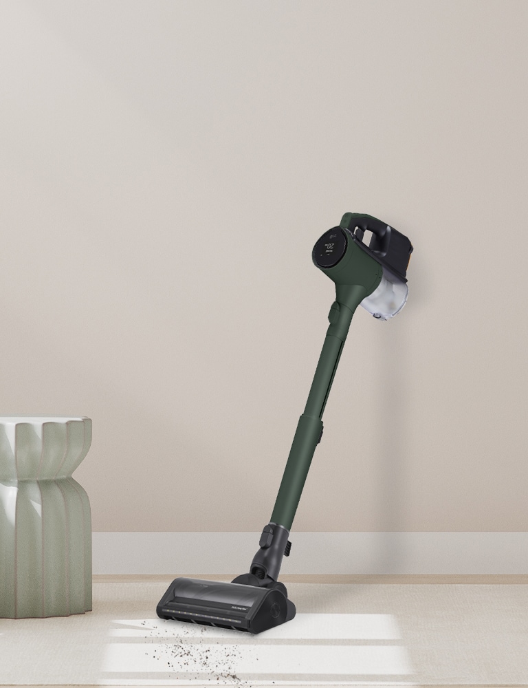 Stick vacuum leaning against the wall.